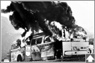 The burning Freedom Rider bus near Anniston, 1961